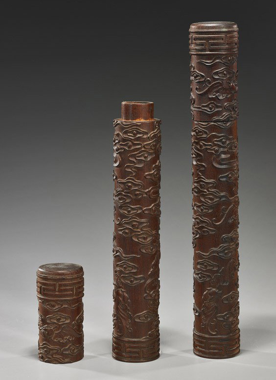 Pair Carved Bamboo Joss Stick Holders: Pair Carved Bamboo Joss Stick Holders Pair unusual and tall, Chinese carved bamboo joss stick holders with covers; each cylindrical and with allover designs of bats among clouds in relief; H: 15 1/4" 