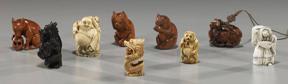 Nine Netsuke-Sized Ivory & Wood Carvings: Nine Netsuke-Sized Ivory & Wood Carvings Group of 9 netsuke and netsuke-sized okimono: 4 ivory: Hotei; writhing dragon; turn-face Hanya; raccoon figure; and 5 wood: 2 cats; ram with branch in its mout