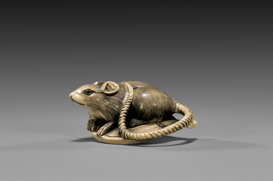 CARVED IVORY NETSUKE: Rat & Fan: CARVED IVORY NETSUKE: Rat & Fan Finely detailed and realistically carved, ivory netsuke; of a rat seated on a round handfan, with inlaid eyes, signed Tomomasa, Circa 1900