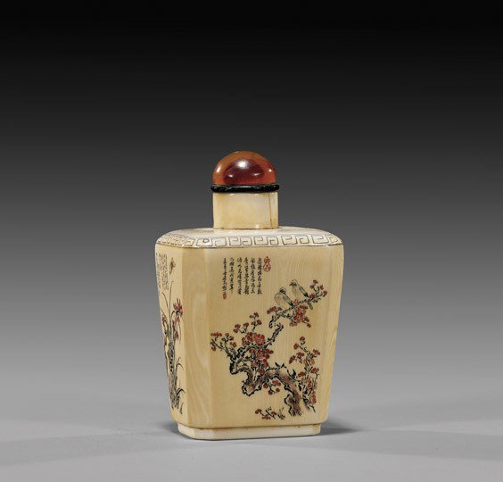 SCRIMMED IVORY SNUFF BOTTLE: SCRIMMED IVORY SNUFF BOTTLE Very finely scrimmed, Chinese ivory snuff bottle; of slightly tapered squared form: depicting detailed floral panels with tiny calligraphy; and with carnelian stopper; H: 3