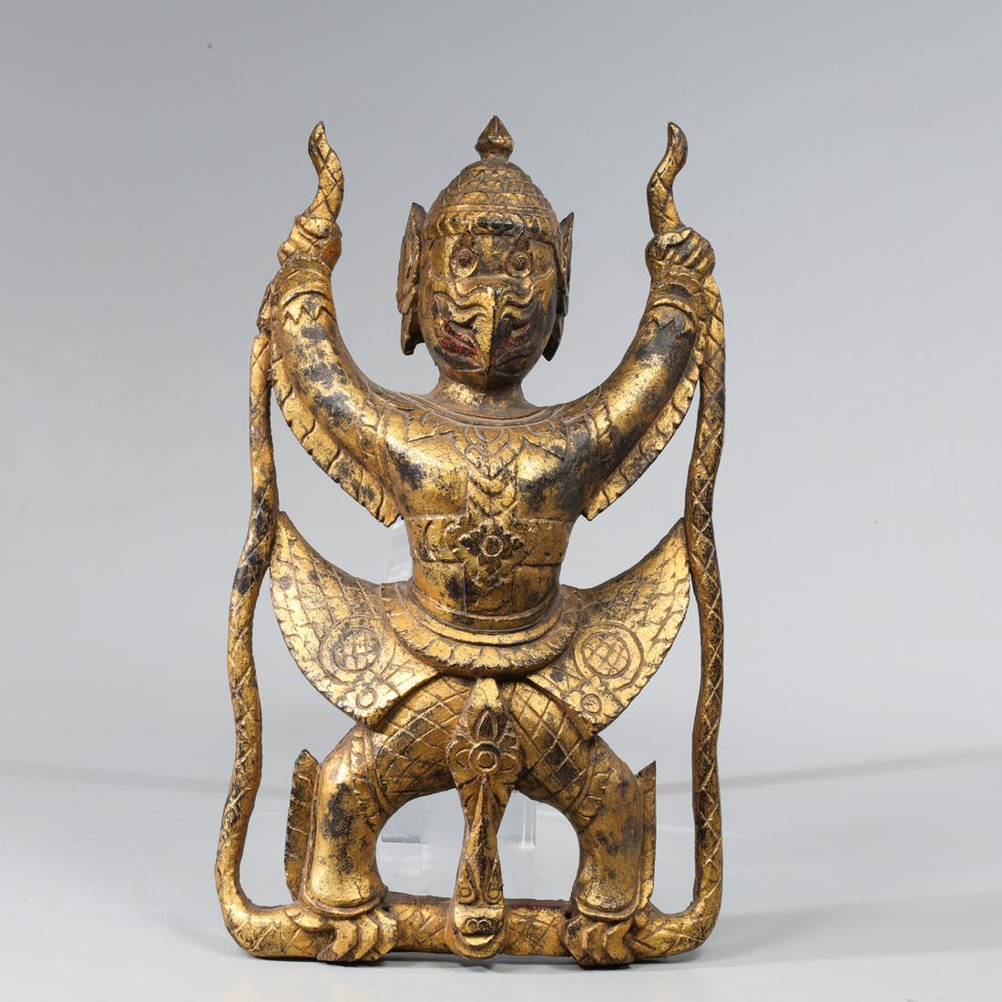 Antique Old Siam Carved Gilded Garuda Figure: Antique, 19th century or later, Old Siam carved wood gilded Garuda figure; as-is condition- General marks and surface wear, scratches, rubbing, flaws, and losses. Possible restorations; L 9 1/2" H 15 