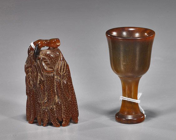 Two Chinese Horn Carvings: Two Chinese Horn CarvingsTwo Chinese horn carvings: pedestal footed cup; together with a pendant or toggle in the form of a Buddha's hand citrine; H: 3 3/4" (higher)