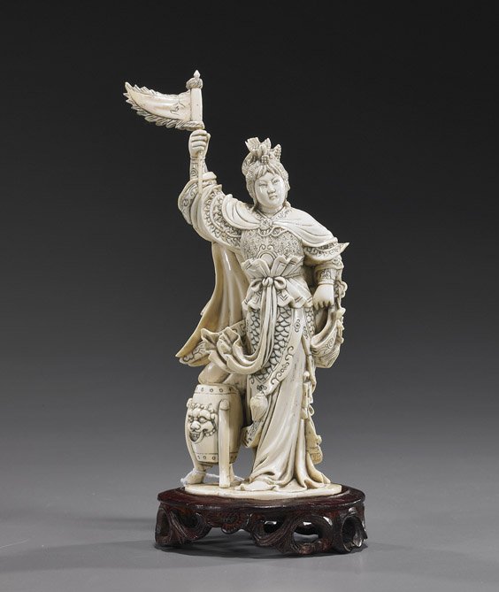 Chinese Carved Ivory Female Warrior: Chinese Carved Ivory Female Warrior Chinese Beijing carved ivory figure of a female warrior; standing in armor and elaborate robes, wearing a phoenix headdress and holding a flag, a drum at her side, 