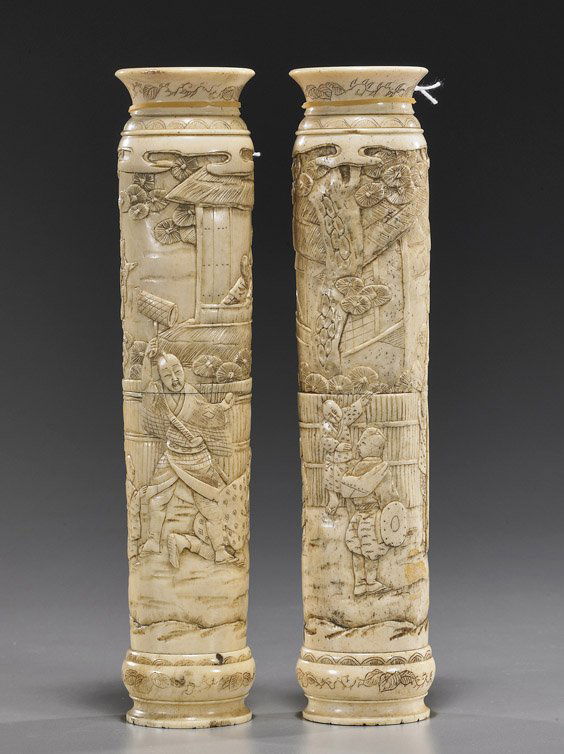 Pair Japanese Carved Bone Vases: Pair Japanese Carved Bone VasesPair Circa 1900, Japanese sectional carved bone vases; each cylindrical with similar continuous low relief designs of various figures in landscapes; H: 7 3/4" (each)