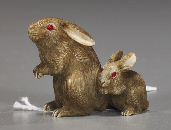 Carved Ivory Netsuke: Two Rabbits: Carved Ivory Netsuke: Two Rabbits Charming, carved and stained ivory netsuke; of 2 rabbits with inlaid eyes, their fur very realistically scrimmed, signed Gyokuseki; Provenance: purchased from Michael