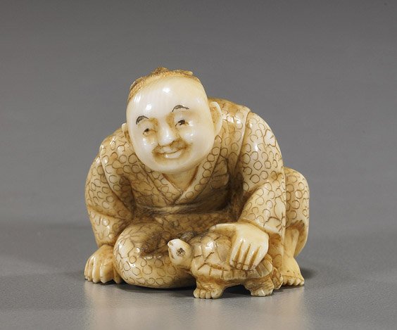 Carved Ivory Netsuke: Boy with Turtle: Carved Ivory Netsuke: Boy with Turtle Charming carved ivory netsuke; of a seated boy with a turtle, finely scrimmed robes, signed Myodo, early 20th Century; Provenance: purchased from Michael Spindel 