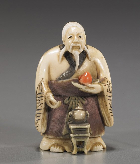 Carved Ivory Netsuke: Figure with Peach: Carved Ivory Netsuke: Figure with Peach Carved and lightly polychromed ivory netsuke; of a standing bearded figure, holding a peach and with a teapot at his feet, signed; Provenance: purchased from Mi