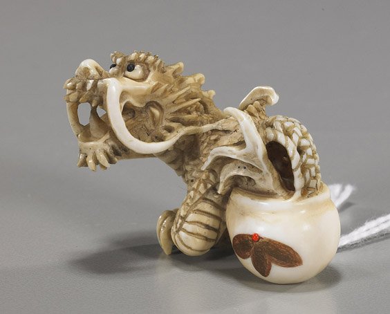 Carved Ivory Netsuke: Dragon in Pot: Carved Ivory Netsuke: Dragon in Pot Very finely carved ivory netsuke; of a dragon emerging from a pot, inlaid eyes, signed Koetsu; Provenance: purchased from Michael Spindel in the 1970s