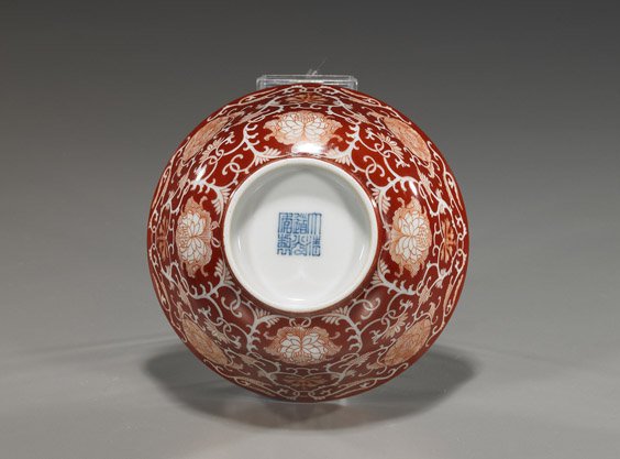 Daoguang-Style Porcelain Bowl: Daoguang-Style Porcelain Bowl Chinese Daoguang-style porcelain bowl; decorated with very elaborate "reverse" pattern coral red Buddhist floral exterior, seal mark; D: 5 1/8"