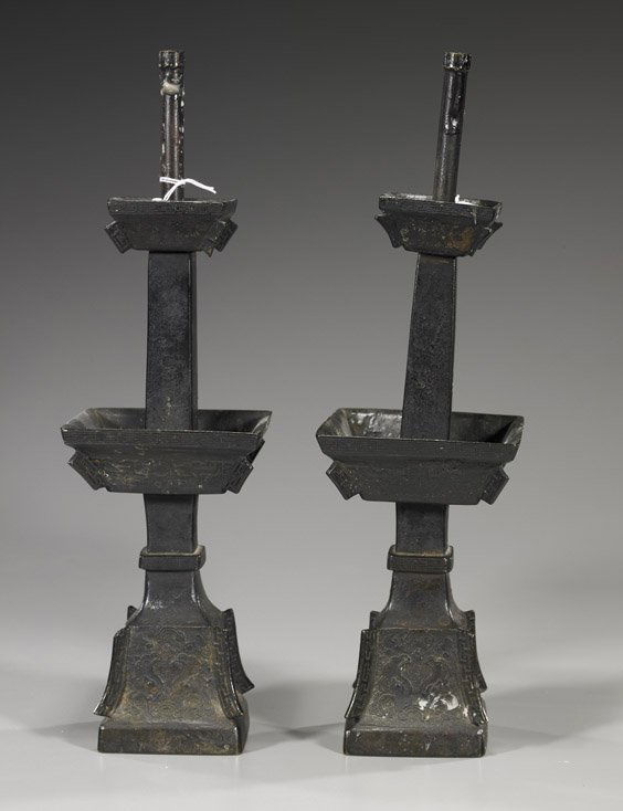 Pair Antique Chinese Bronze Candle Holders: Pair Antique Chinese Bronze Candle HoldersPair tall and antique, Chinese bronze temple candle holders; each somewhat archaistic and of square sectional form with low relief taotie-type motifs (one res