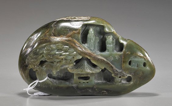 Chinese Carved Spinach Jade Pebble: Chinese Carved Spinach Jade Pebble Chinese carved spinach jade pebble; retaining its naturalistic form and carved on the interior with figures, temple and pine in high relief and openwork; L: 7"