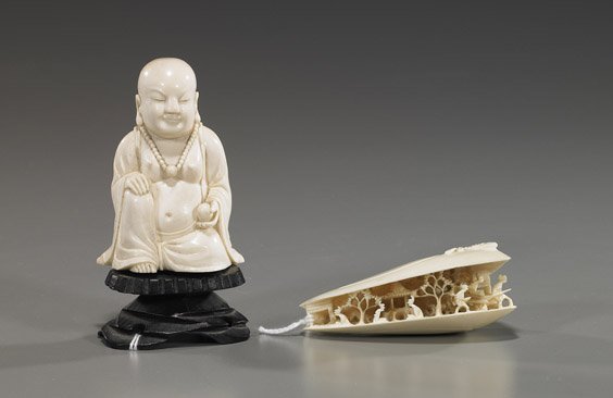 Two Various Chinese Carved Ivories: Two Various Chinese Carved Ivories Two Chinese carved ivories: early 20th Century clam's dream, the interior with detailed openwork scene of figures and dwelling among trees; together with a Budai sea