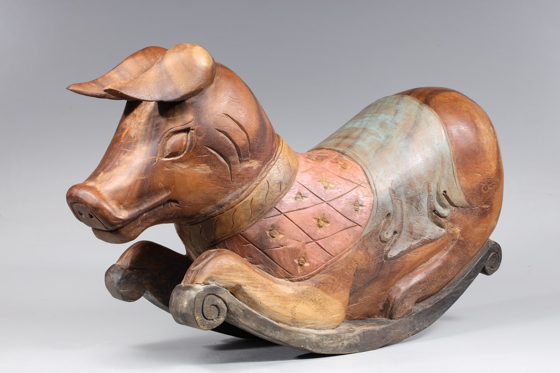 Carved Pig Child's Rocker: Hand carved wood pig form child's rocker; as-is condition- General marks and surface wear, scratches, rubbing, flaws, and losses. Possible restorations; L 30" H 16" (Approx.)