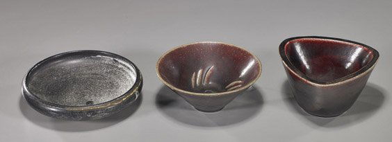 Three Danish Glazed Stoneware Vessels: Three Danish Glazed Stoneware VesselsThree Danish glazed stoneware vessels: 2 Royal Copenhagen signed and marked pieces by Jais Nelsen: triangular rimmed red dish with animal in relief on the interior