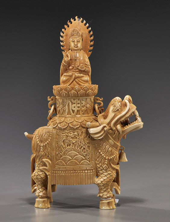Chinese Carved & Stained Ivory Guanyin: Chinese Carved & Stained Ivory GuanyinChinese carved and stained sectional ivory Guanyin; seated in lotus posture on a lotus pedestal atop a standing qilin: with flaming mandorla, one hand in mudra an