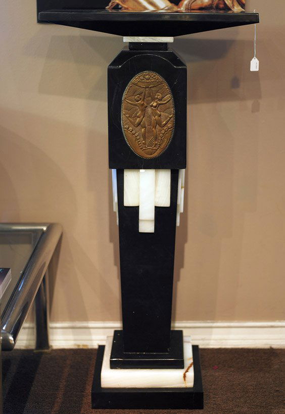 Tall Black Onyx Pedestal: Deco Style: Tall Black Onyx Pedestal: Deco StyleTall Art Deco-style sectional pedestal; in black onyx with white onyx details and with an oval plaque with design of two nude dancing figures, with rotating platfor