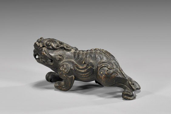 CHINESE BRONZE STRIDING QILIN: 銅雕麒麟 CHINESE BRONZE STRIDING QILINChinese bronze model of a striding qilin: with mouth open, and with realistic detailing of the curled mane along its back; possibly Ming;