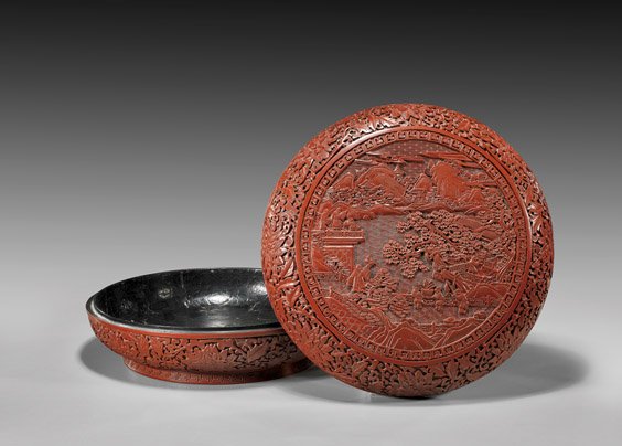 CHINESE CARVED CINNABAR LACQUER BOX: 剔紅風景人物詩文蓋盒 CHINESE CARVED CINNABAR LACQUER BOXLarge and very elaborately carved, Chinese red (cinnabar) lacquer box and cover; of