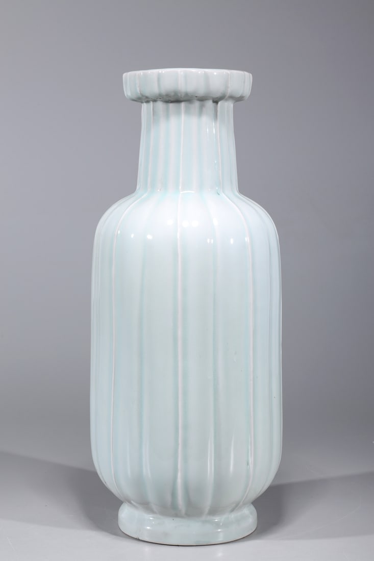 Chinese Celadon Glazed Porcelain Vase: Chinese celadon glazed porcelain vase with ribbed design to body; overall good condition; H 18 1/4" x D 7 3/4" (approx.)