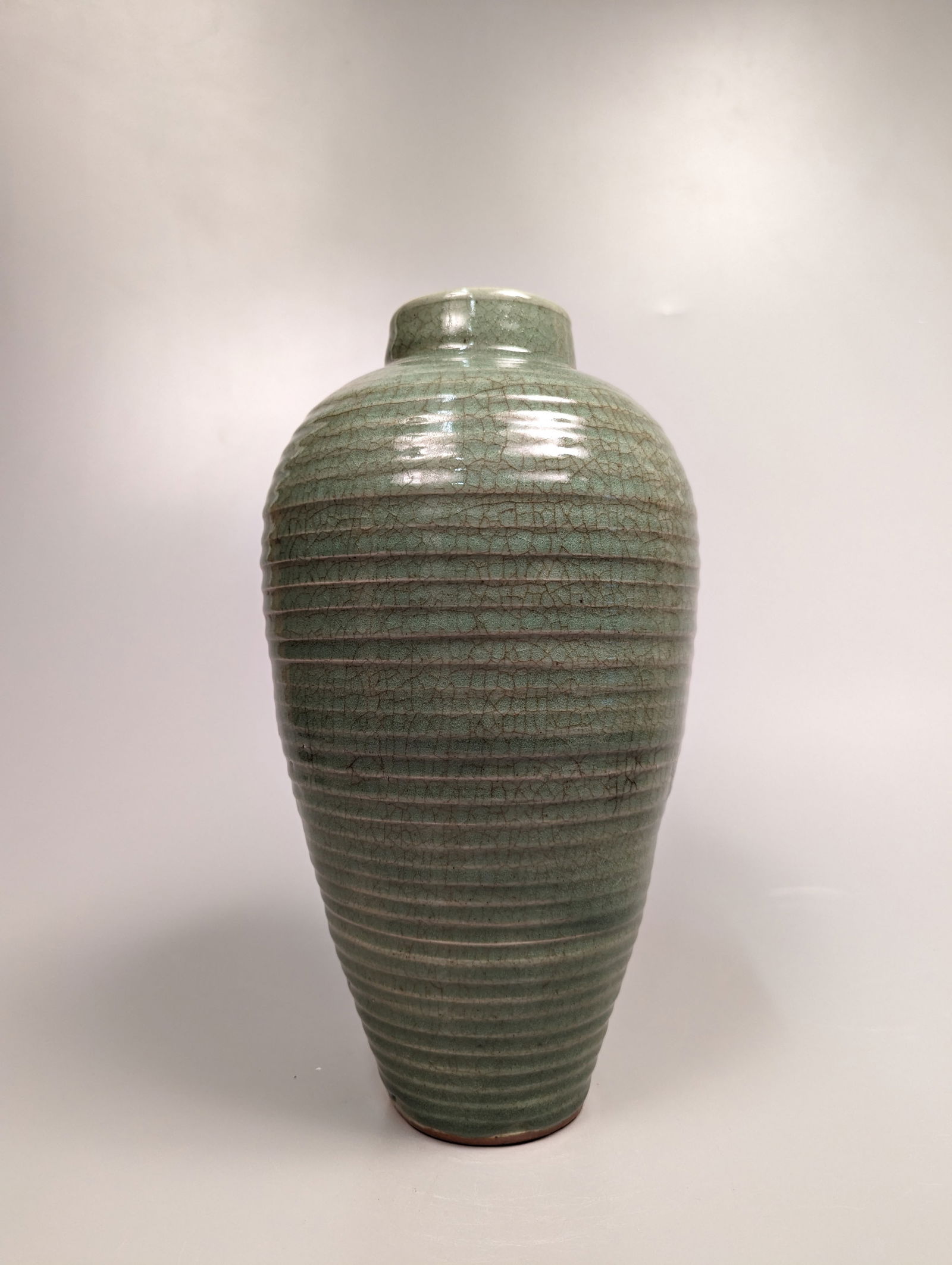 Tall Song/Yuan-Style Crackle Celadon Ribbed Vase: Tall Chinese Song/Yuan-style, crackle celadon glazed vase of ribbed tapered form and slightly tapered neck; some minor wear; H: 14" (approx.)