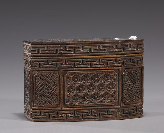 Antique Chinese "Faceted" Wood Box: Antique Chinese "Faceted" Wood Box Unusual antique Chinese wood box and cover; of faceted lozenge form, the body carved with various geometric patterns in relief (some wear); L: 5 1/4"