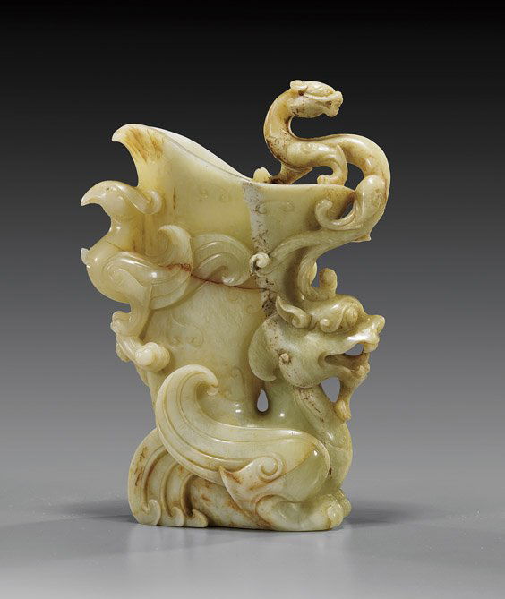 Chinese Carved Yellow Jade Ewer: Chinese Carved Yellow Jade EwerChinese carved yellow jade ewer; rhyton-form with dragon head at the base H: 9 1/2"