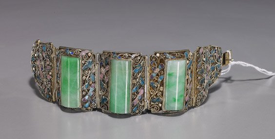 Chinese Enameled Silver & Jadeite Bracelet: Chinese Enameled Silver & Jadeite BraceletEarly 20th, Century Chinese silver gilt filigree bracelet: with champlevé enamel foliate motif, and set with 3 long polished jadeite panels (one with crack),