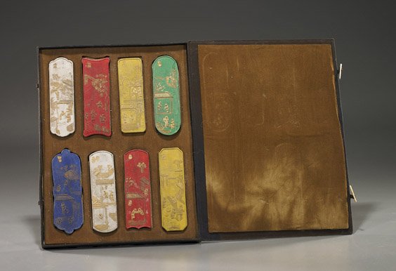 Boxed Set of 8 Chinese Inkstones: Boxed Set of 8 Chinese Inkstones Boxed set of 8 Chinese inkstones; in various shapes and colors: each with gilt designs of figures in a landscape with dwellings, the versos with inscription; L: 5" (lo