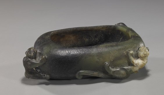 Chinese Green & Black Jade Brushwasher: Chinese Green & Black Jade Brushwasher Chinese carved green and black jade archaistic brushwasher; of rounded rectangular form with 2 hydra and phoenix in relief; L: 6 3/4"