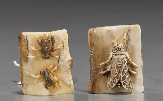 Two Carved Fossil Ivory Netsuke: Insects: Two Carved Fossil Ivory Netsuke: Insects Two carved fossil ivory netsuke: one with two winged insects, the other with a single larger winged insect; the verso with bamboo texture, both signed