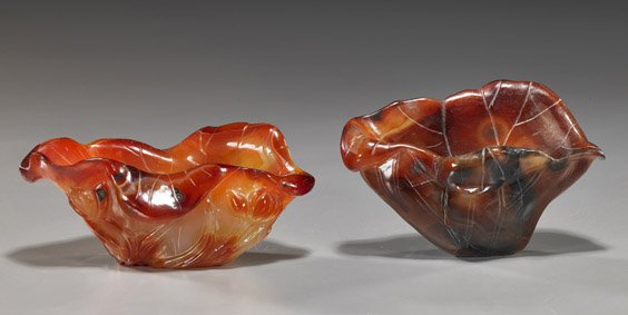 2 Chinese Carved Carnelian Brushwashers: 2 Chinese Carved Carnelian Brushwashers Two early 20th Century, Chinese carved carnelian agate brushwashers; each of lotus leaf form and both with good coloration (natural inclusions to each); H: 5" (