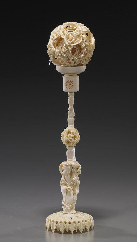 Chinese Carved Ivory Puzzle Ball & Stand: Chinese Carved Ivory Puzzle Ball & StandVery elaborately carved, Chinese puzzle ball on a tall sectional ivory stand: the ball comprised of at least 10 concentric openwork balls, the exterior with wri
