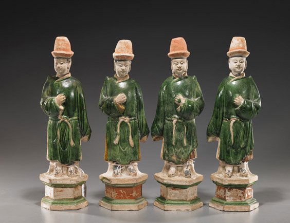 Set of 4 Ming Dynasty Glazed Pottery Figures: Set of 4 Ming Dynasty Glazed Pottery FiguresSet of 4, Chinese Ming Dynasty parcel green glazed and painted pottery tomb figures/grooms: each standing in long robes and cap, holding a closed fist to hi