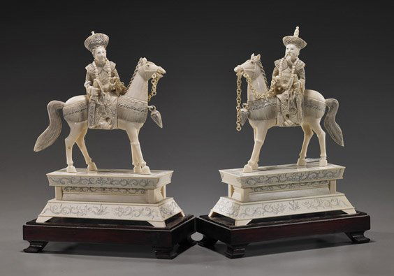 Pair Ivory Equestrian Emperor & Empress: Pair Ivory Equestrian Emperor & EmpressPair Chinese carved ivory equestrian Emperor & Empress: each on raised rectangular sectional ivory appliquï¿½ bases; each holding loose-ring reigns and swords