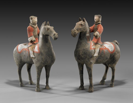 PAIR CHINESE HAN DYNASTY EQUESTRIANS: 漢 騎馬人俑 一對 PAIR HAN DYNASTY POTTERY EQUESTRIANS Rare pair and very elaborately painted, Chinese Han Dynasty pottery equestrian: each finely modeled and 