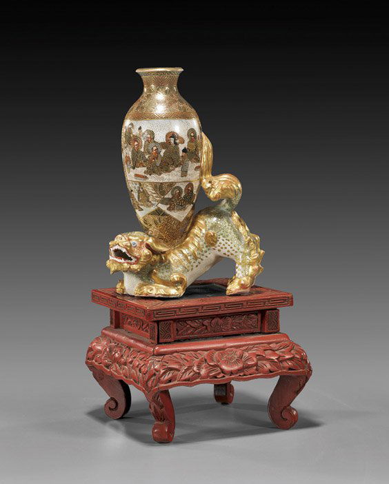 Antique Japanese Satsuma Shi-shi with Vase: Antique Japanese Satsuma Shi-shi with VaseVery unusual, antique Japanese Satsuma earthenware Shi-shi: crouching and with a vase on its back with elaborate figural panels, signed and with mon (minor ri
