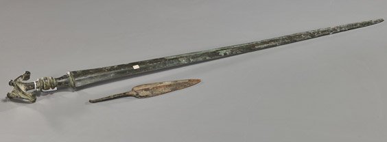 Two Bronze Weapons: Spear Head & Ancient Sword: Two Bronze Weapons: Spear & Ancient Sword Two various bronze weapons: probably ancient bronze spear head; together with an ancient bronze sword with narrow blade and detailed hilt, possibly Luristan (