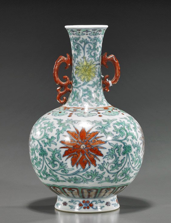 Chinese Doucai Porcelain Cabinet Vase: Chinese Doucai Porcelain Cabinet Vase Chinese Qianlong-style, doucai enameled porcelain vase; bottle form with scrolling handles and with allover Buddhist floral motifs, seal mark (piece of handle mis