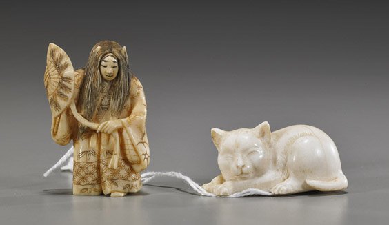 Two Carved Ivory Netsuke: Hanya Dancer & Cat: Two Carved Ivory Netsuke: Hanya Dancer & Cat Two carved ivory netsuke: turn-face Hanya dancer carrying a fan; and a recumbent sleeping cat (old crack to cat), both signed; H: 2 1/4" (taller)