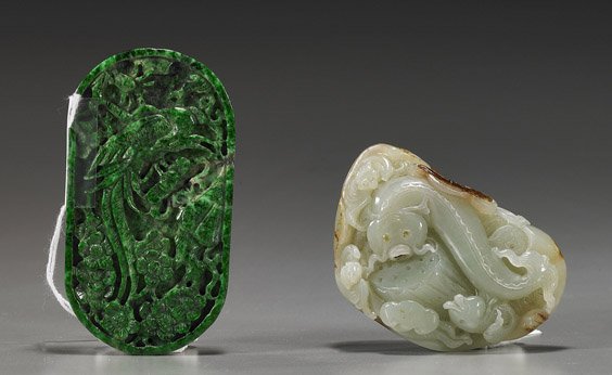 Two Chinese Carved Jade Pendants: Two Chinese Carved Jade Pendants Two Chinese carved jade pendants: celadon jade pebble with carp, bats, ruyi, and lotus, with some remaining pebble "skin"; together with a brilliant green chloromeloni