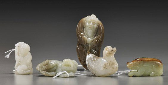 Five Chinese Celadon Jade Carvings: Five Chinese Celadon Jade CarvingsGroup of 5 Chinese celadon jade carvings, including: bi-color sage with fish; recumbent lion; boy with a peach; duck and pig; L: 3 1/4" (largest)