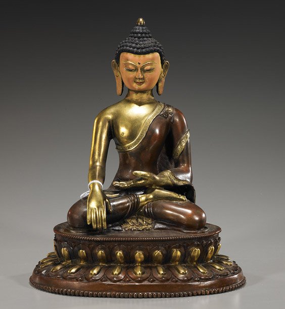 Sino-Tibetan Bronze Buddhist Figure: Sino-Tibetan Bronze Buddhist Figure Sino-Tibetan, parcel-gilt coppery bronze Buddhist figure; seated in lotus posture atop a stylized lotus base and with hands in mudra, polychrome to face (some wear)