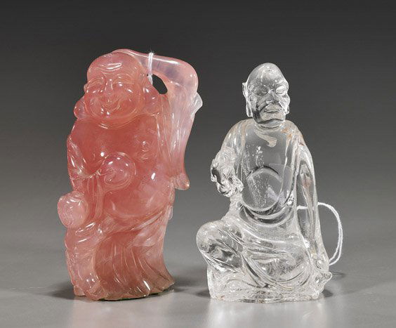 2 Chinese Figures: Rock Crystal & Rose Quartz: 2 Chinese Figures: Rock Crystal & Rose QuartzTwo Chinese carved figures: rock crystal seated Lohan holding a lion pup, remarkably clear and with only minor interior inclusions; together with a bright