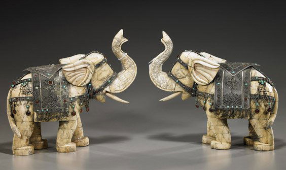 Pair Bone Elephants with Silvered Trappings: Pair Bone Elephants with Silvered TrappingsPair Chinese sectional carved bone elephants; each standing in a walking pose and with trunks raised; each with silvered and "jeweled" filigree-type capariso