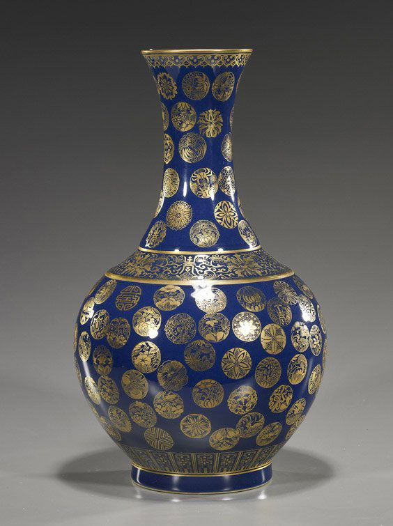 Fine Tall Chinese Glazed Porcelain Vase: Fine Tall Chinese Glazed Porcelain VaseVery heavily potted and finely detailed, Chinese Guangxu-style cobalt blue monochrome glazed porcelain vase; bottle form with finely gilt mon reserves and lotus