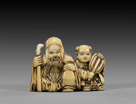 ANTIQUE IVORY NETSUKE: Sage & Karako: 象牙根付 ANTIQUE IVORY NETSUKE: Sage & Karako Well carved and antique, ivory netsuke; of a bearded sage with staff sitting next to a karako with fan; unsigned, 19th Century; wi