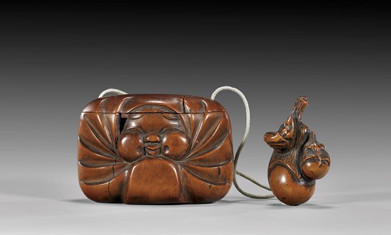 ANTIQUE TOBACCO BOX SUITE: 木製日本煙草盒及根付 ANTIQUE TOBACCO BOX SUITE Unusual and amusing, antique Japanese carved wood tobacco box: with design of Okame, with a w