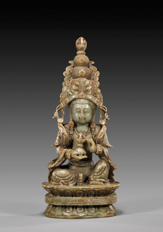 SINO-TIBETAN STYLE JADE BUDDHIST DEITY: 玉嵌寶石佛坐像 SINO-TIBETAN STYLE JADE BUDDHIST DEITY Unusual and very elaborately carved, Chinese/Sino-Tibetan style jade Buddhist deity: holding a phurba an