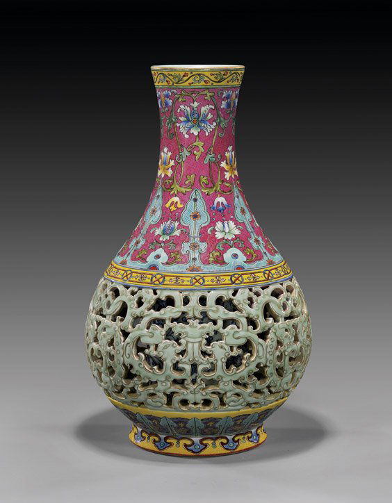 FAMILLE ROSE SECTIONAL PORCELAIN VASE: 粉紅地粉彩鏤空鳳紋瓶 FAMILLE ROSE SECTIONAL PORCELAIN VASEUnusual Chinese Qianlong-style sectional porcelain vase; of bottle form; with elab