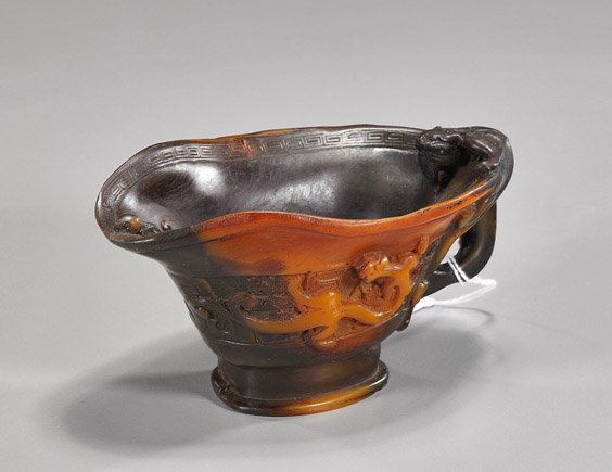 Rhino-Like Composition Libation Cup: Rhino-Like Composition Libation Cup Rhino-like composition libation cup, carved with hydra and with characters to the base; L: 5 1/2"